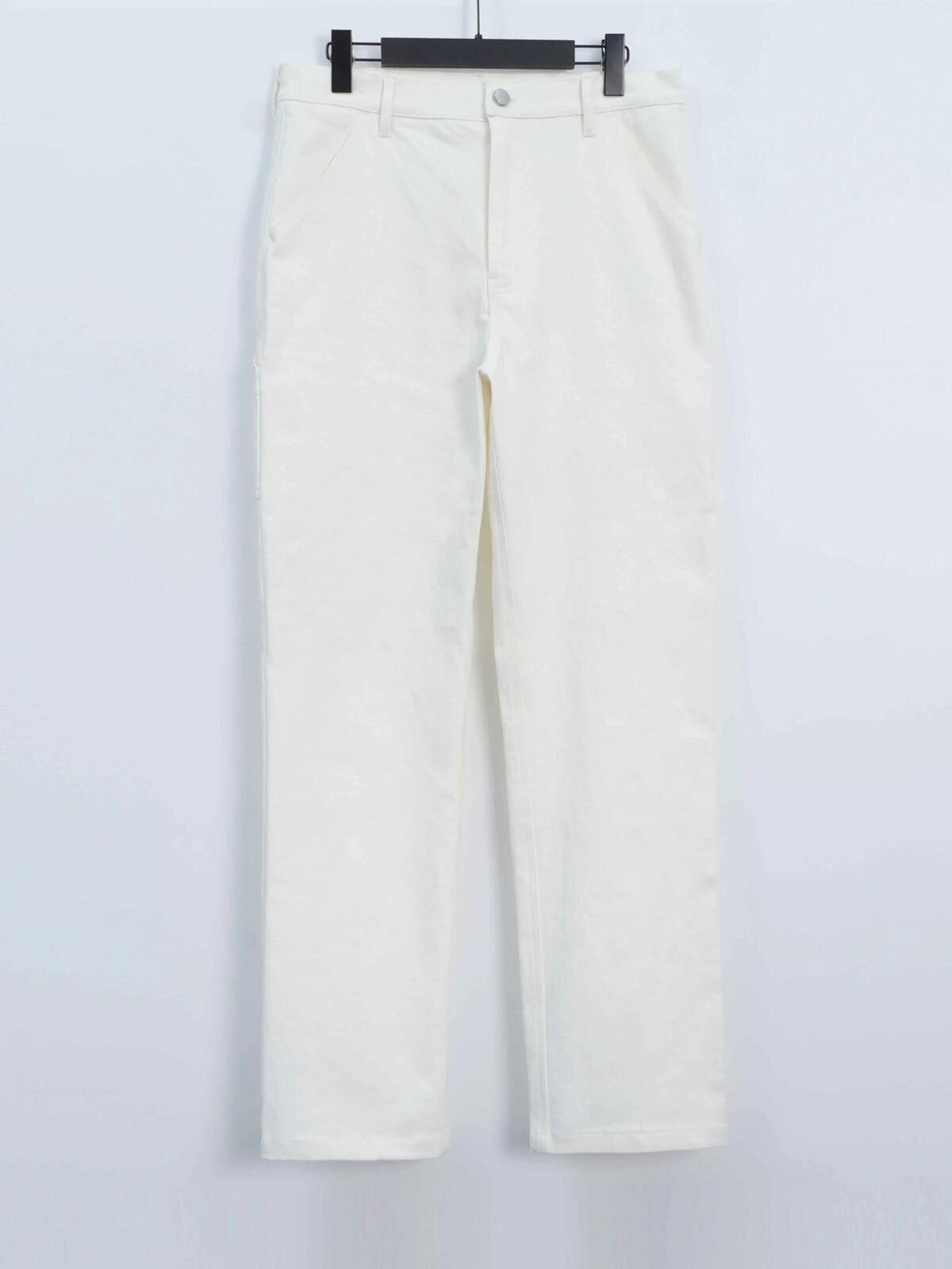 Painter Whites utility pant, front view on a hanger, showing waistband, button closure and side pockets